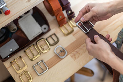 High angle view of man using mobile phone on table