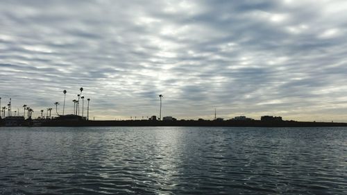 View of city against sky during sunset