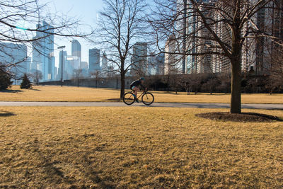 Man cycling in park 