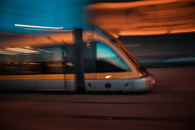Blurred motion of car on road at night
