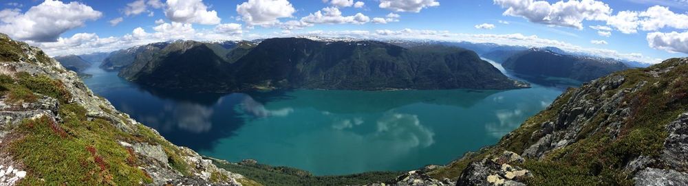 Scenic shot of calm lake with mountains in background