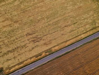 High angle view of road amidst field