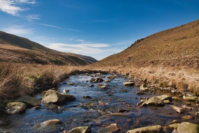 Scenic view of stream against sky