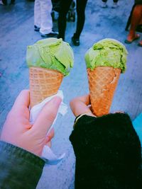 Close-up of cropped hands holding ice cream