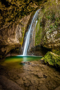 Scenic view of waterfall in forest