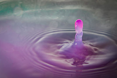 High angle view of pink water splashing in lake