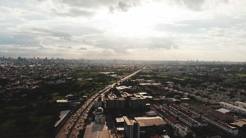 High angle view of illuminated city against sky