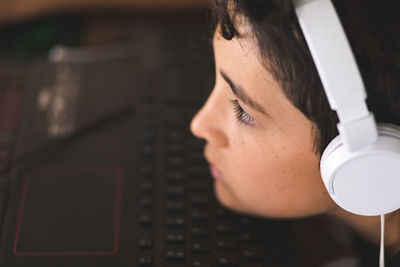 Boy doing his homework on laptop