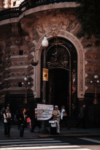 Group of people in front of building