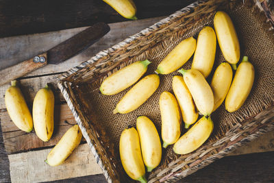 High angle view of fruits in basket on table