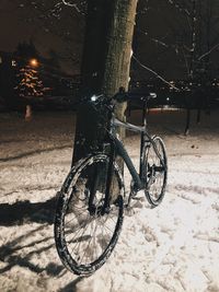 Bicycle parked on street during winter