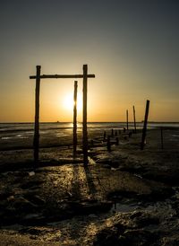 Scenic view of beach against sky during sunset