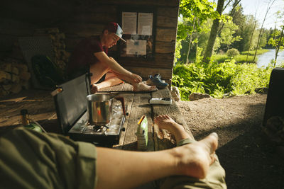 Young people at campsite barefoot