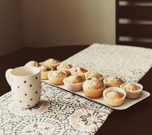 Muffins in tray on table
