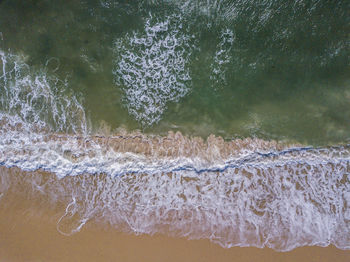 Close-up of waves rushing towards shore