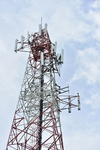 Low angle view of communications tower against sky