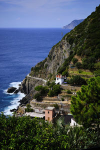 High angle view of buildings by sea against sky