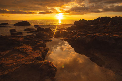 Scenic view of sea against sky during sunset