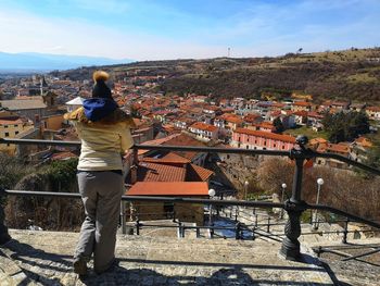 Tourist from behind observes pescina in abruzzo