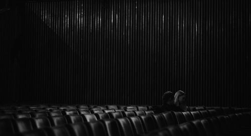 Rear view of man sitting on seat