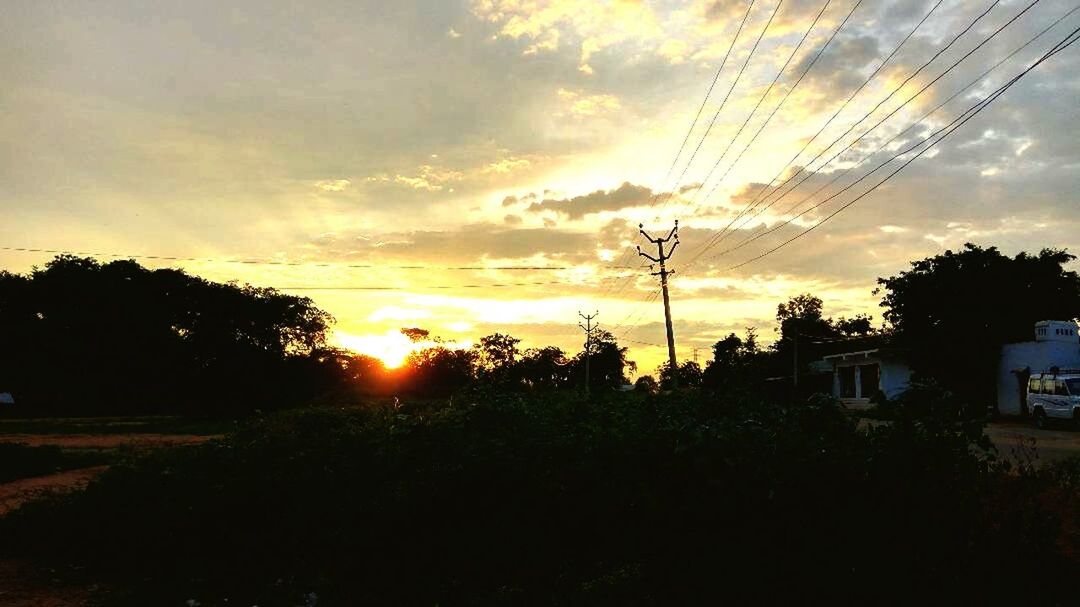 SCENIC VIEW OF SILHOUETTE TREES AGAINST SKY AT SUNSET