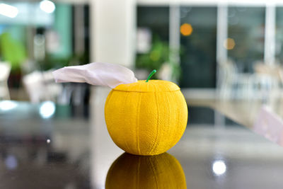 Close-up of yellow pumpkin on table