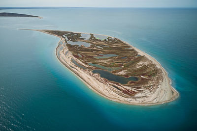 High angle view of sea shore against sky