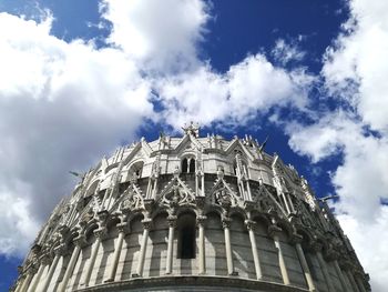 Low angle view of historical building against cloudy sky