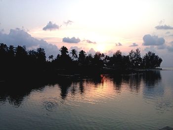 Scenic view of lake at sunset