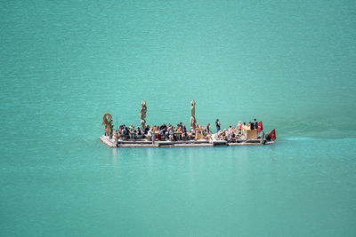 High angle view of people on boat in sea