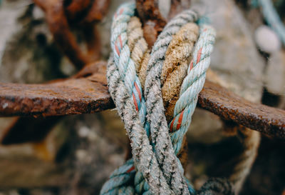 Close-up of rope tied on rusty metal