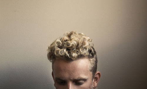 Close-up of man against gray background