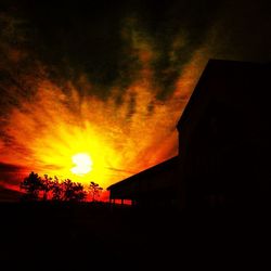 Silhouette of house at sunset