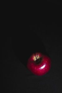 High angle view of apple against black background