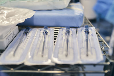 Close-up of medical instrument on rack at hospital