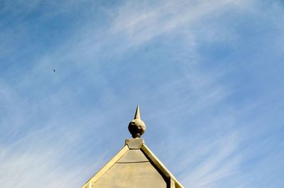 Low angle view of bird flying against sky