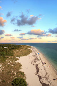 Scenic view of beach against sky during sunset