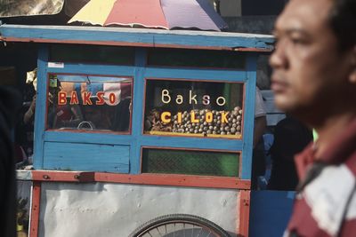 Portrait of meatball cart and my father. this photo was taken in jakarta on 4 december 2019.