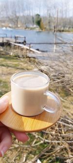 Person holding coffee cup