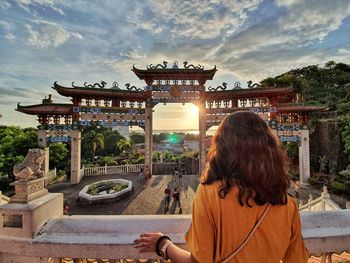 Rear view of woman looking at temple