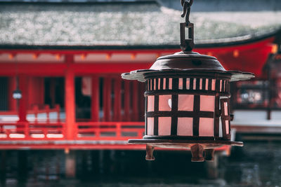 Close-up of lantern hanging outside temple