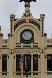 Low angle view of clock tower against sky