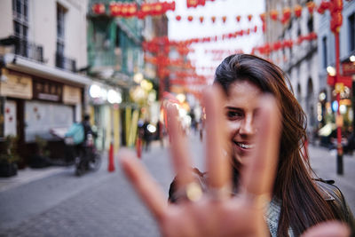 Portrait of smiling woman on street in city