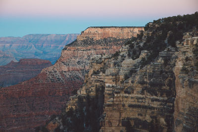 Low angle view of rock formations against sky