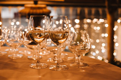 Close-up of wine glasses on table