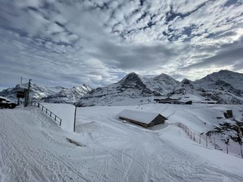 Scenic view of snow covered mountains against sky