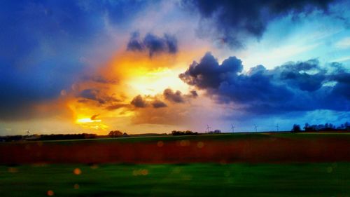 Scenic view of landscape against cloudy sky