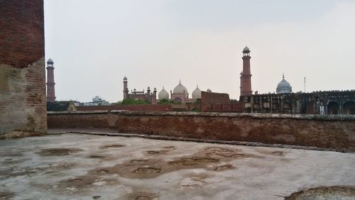 View of mosque against sky during winter