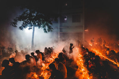 Silhouette of people at night