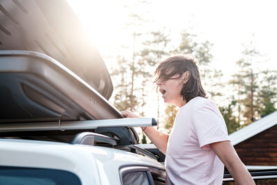 Side view of woman in car